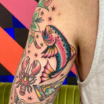 Celestial-themed gap filler tattoo