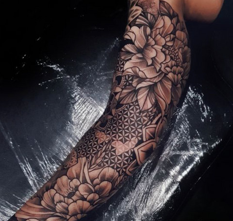 Geometric-themed gap filler tattoo