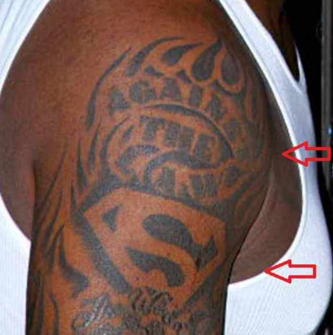 Shaquille O'Neal's Superman tattoo symbolizing strength and his superhero persona