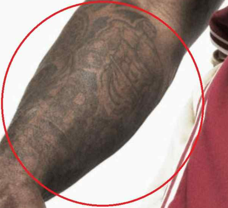 Shaquille O'Neal's boxer tattoo reflecting his love for combat sports and fitness
