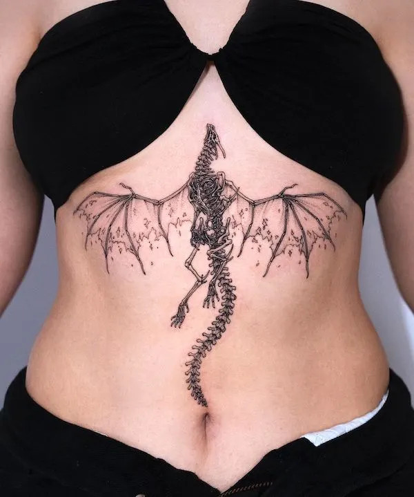 Skeleton dragon sternum tattoo embodying power with dark aesthetics.