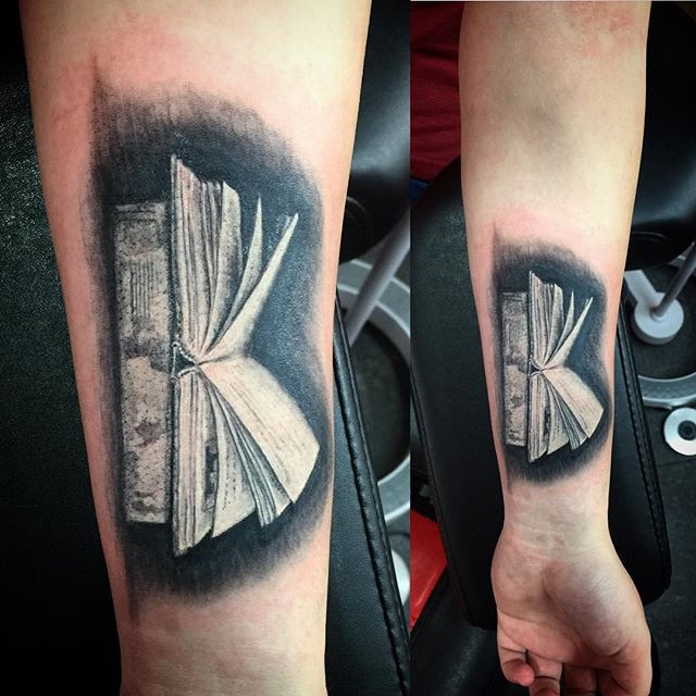 Small open book tattoo