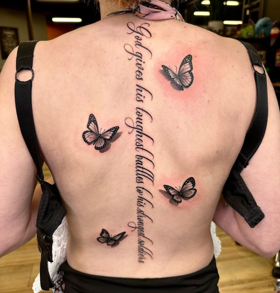 A stunning spine tattoo featuring intricate floral details, showcasing the artistry and precision required for such designs