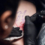 Tattoo artist carefully preparing their workstation
