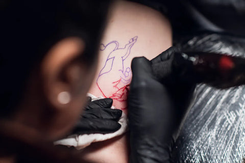 Tattoo artist carefully preparing their workstation