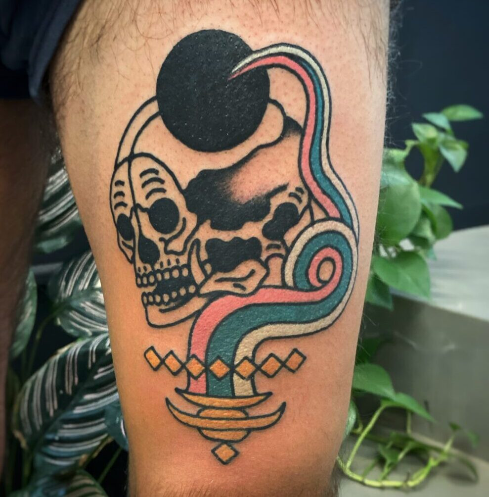 A collection of black ink tattoos on an arm