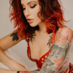 Peony tattoo on shoulder, traditional Japanese style with bold outlines and vibrant colors