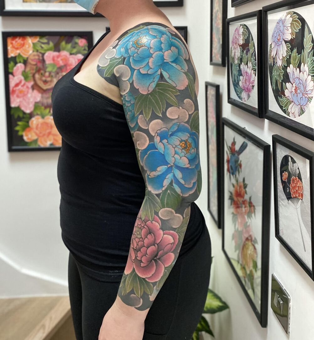 Japanese inspired peony tattoo by Rodrigo Souto with black outlines
