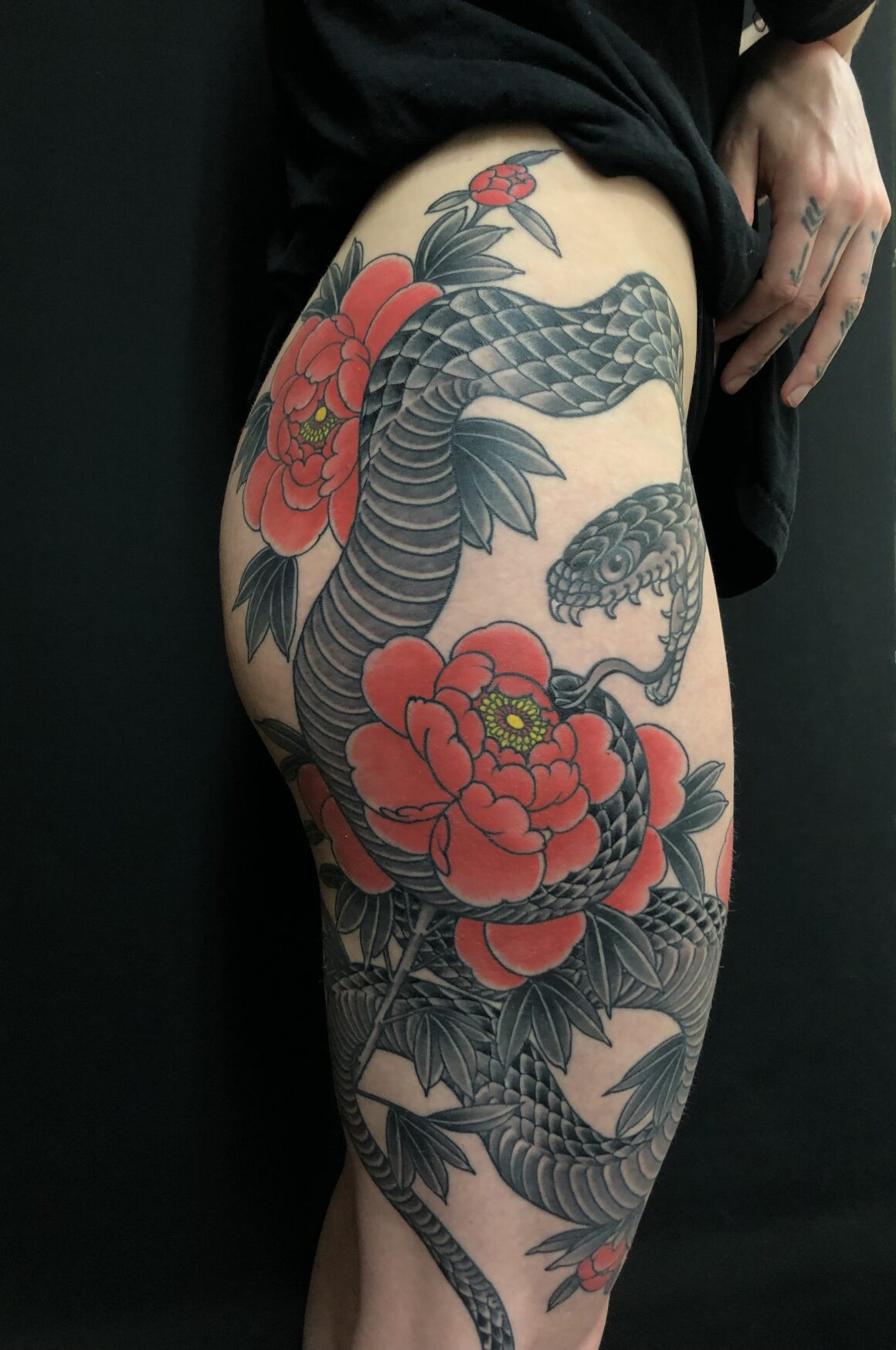 Rodrigo Souto peony tattoo with elegant shading and delicate linework