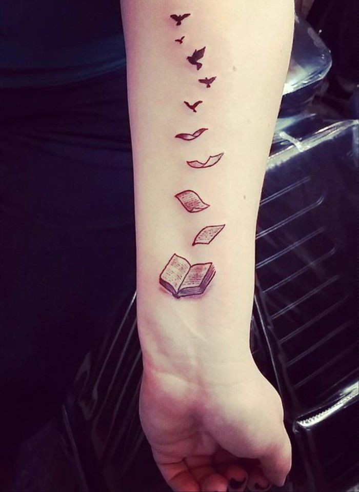Book tattoo transforming into birds