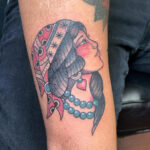 Traditional Tattoo Style Gypsy with bold black outlines and vibrant colors