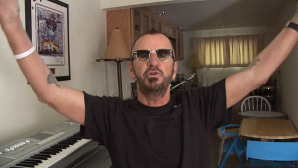 Ringo Starr displaying his lotus flower tattoo, possibly as a tribute to George Harrison and a symbol of enduring through challenges