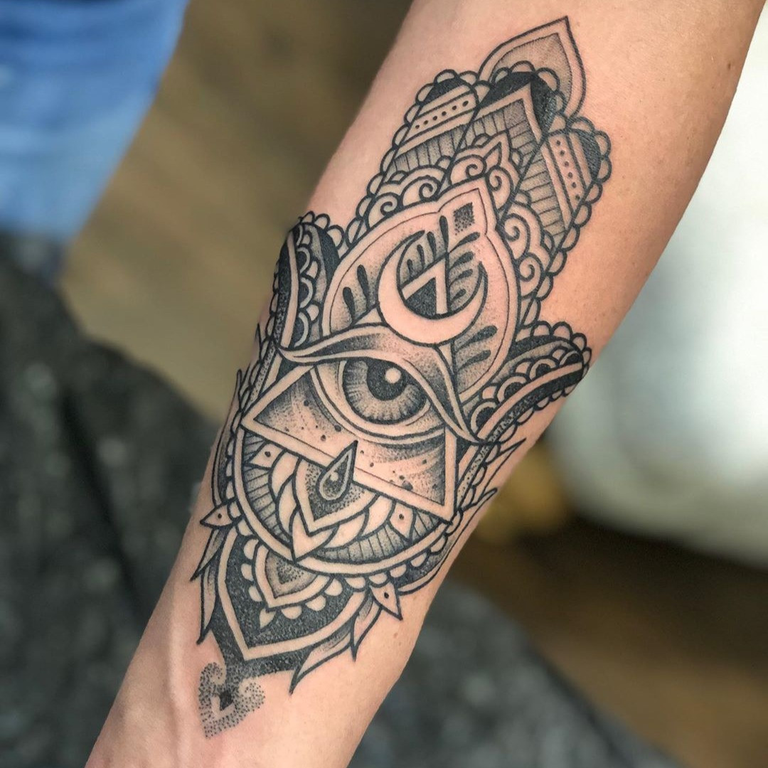 A Hamsa tattoo with clean lines and minimal shading, emphasizing the importance of proper aftercare for lasting beauty