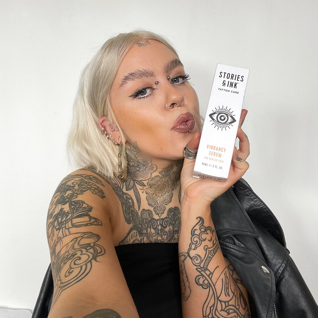Woman with arm tattoos