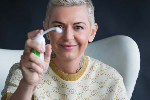 Woman cleaning arm tattoo