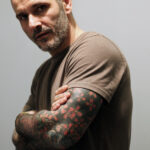 Arm tattoo with loose-fitting t-shirt