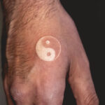 White ink hand tattoo showcases the subtle beauty of body art