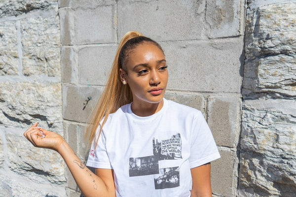 Woman in a baggy t-shirt, ideal for a stomach tattoo session