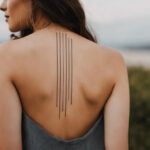 Woman with a straight line tattoo design on the back
