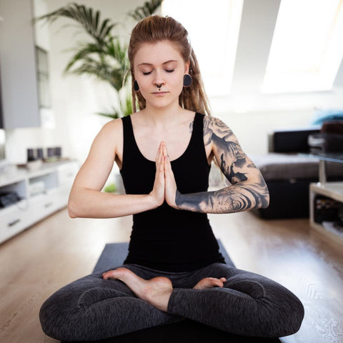 Consider yoga and stretching as safe workouts for tattoo aftercare
