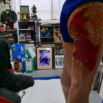 Yakuza elder with a koi fish tattoo representing perseverance and courage