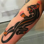 Black panther tattoo on arm