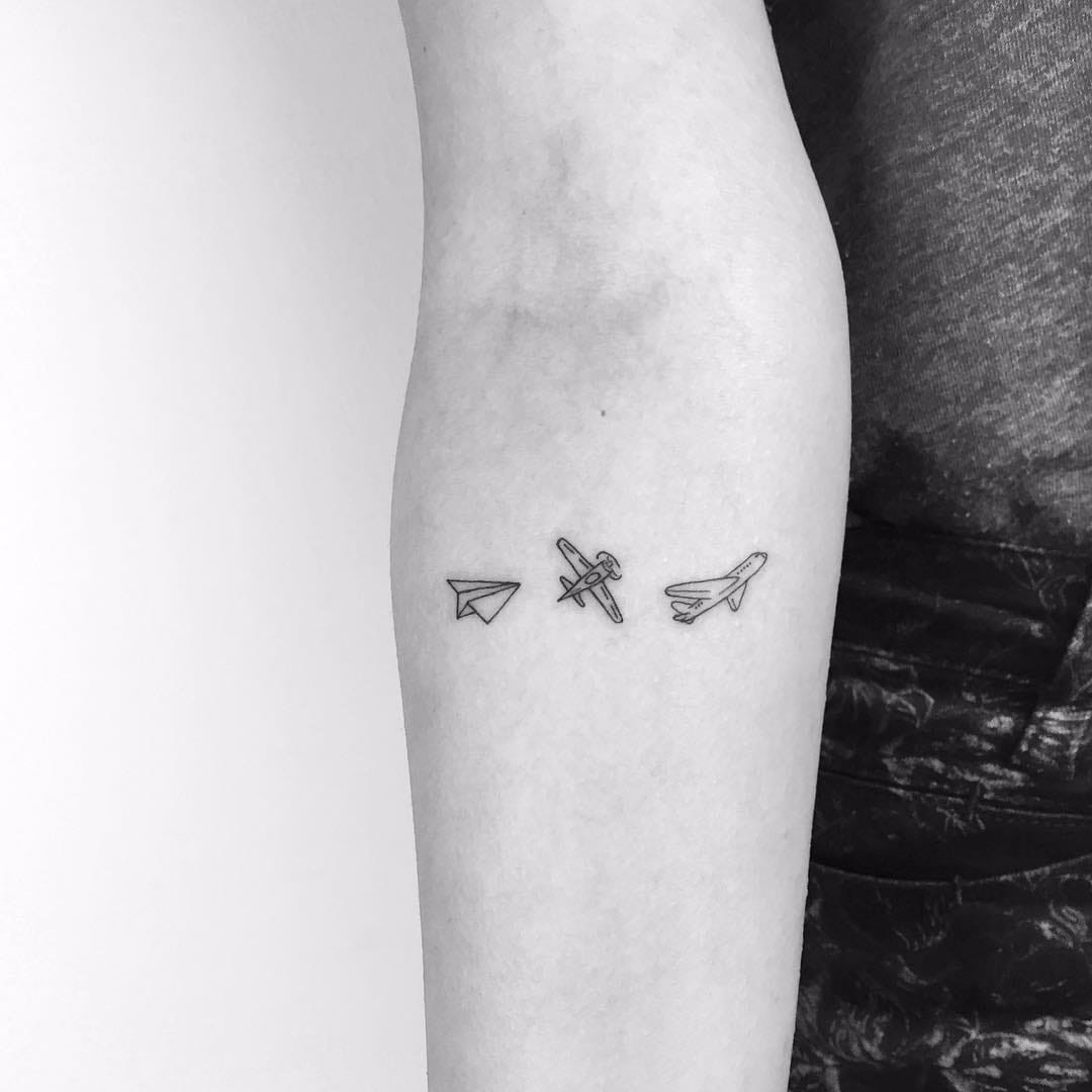 Single dot tattoo on the wrist symbolizing a minimalist statement of self-expression.