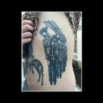 ACAB tattoos – black ink, illustrative tattoo of four dead bodies in uniform hanging from a meat factory hook
