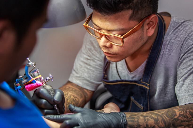 How Much Do Spine Tattoos Cost - A close-up of a well-healed spine tattoo featuring a delicate floral design, showcasing the importance of proper aftercare.