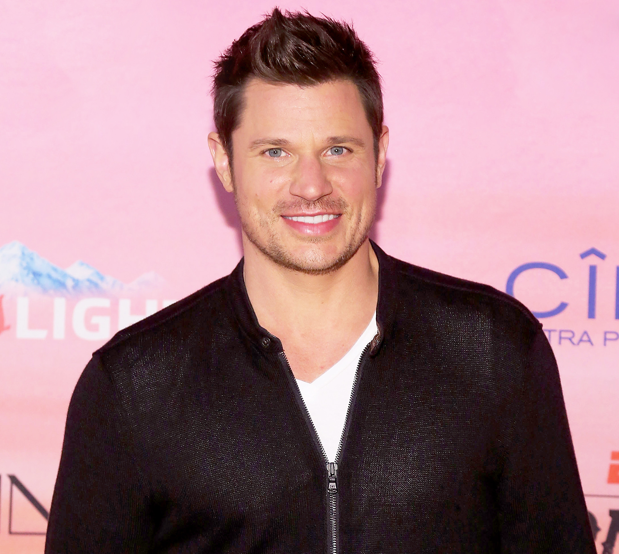 Nick Lachey's sun tattoo with '98 Degrees' inscription, symbolizing his boy band era pride.