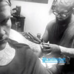 Travis Bacon's pig tattoo cover-up, showcasing his unique and bold artistic expression.