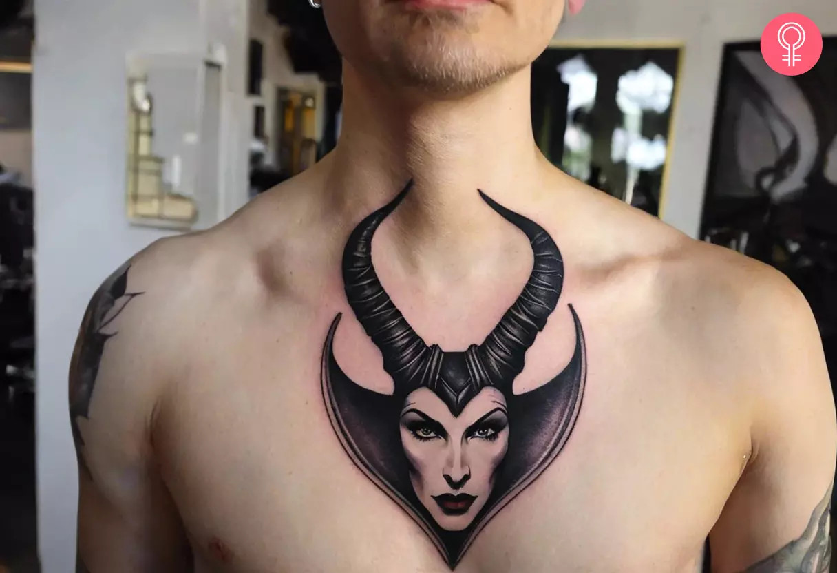 A man displaying a Maleficent horn tattoo on his chest, a bold statement of power and lack of trust