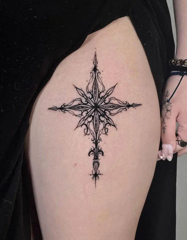 Intricate black ornament tattoo on the thigh, by @kwann_ew.blk_, creating an elegant and gothic design