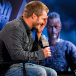 Travis Fimmel image from Vikings, showcasing his shaved head.