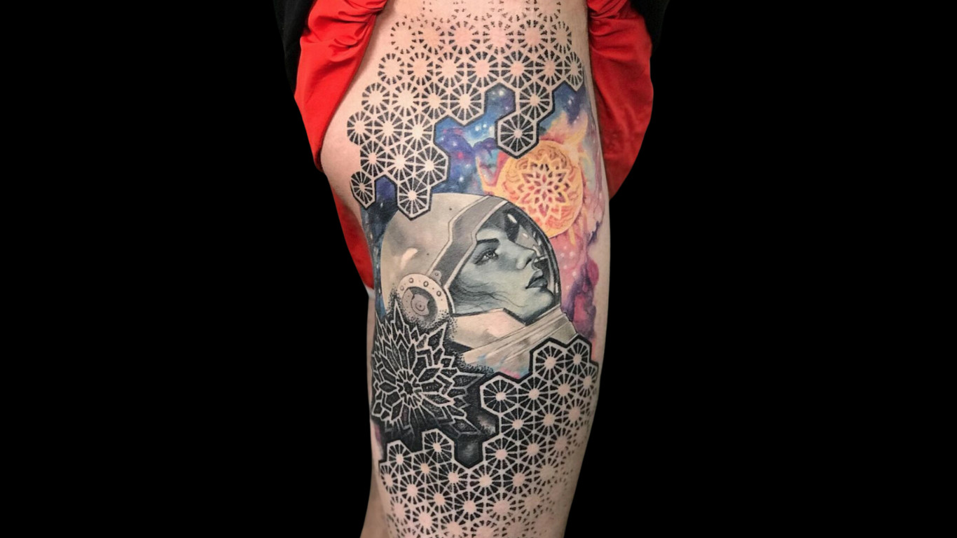 Multi-style geometric thigh tattoo by Corey Ferguson. Dedicated clients can team up with their artist to bring their ideas to on the skin.