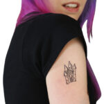 Traditional American tattoo of a rose with bold lines and simple shading