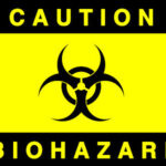 Biohazard tattoo design on forearm