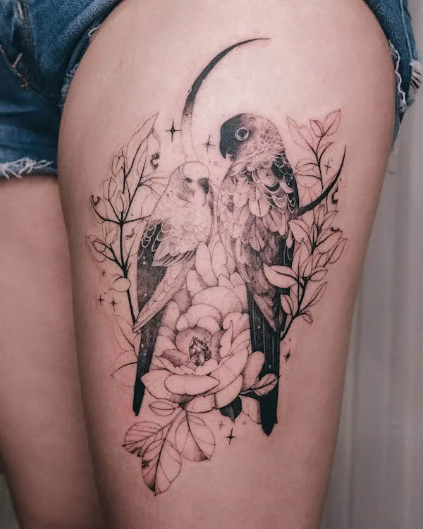 Intricate bird and flowers tattoo on the thigh, by @mylittleblueforest, symbolizing freedom and natural beauty