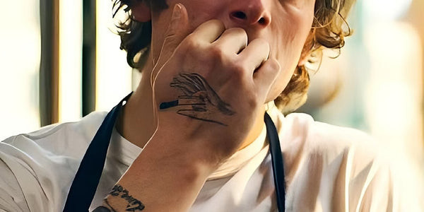 Carmy's knife tattoo, symbolizing dedication and pain