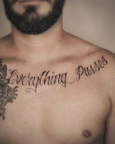 Inspirational quote tattoo along the collarbone