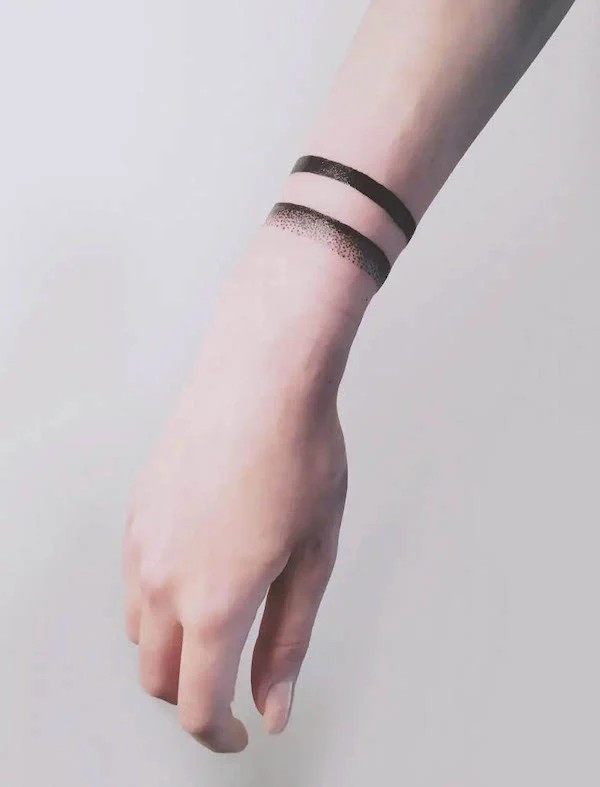 Unique double band around the wrist bracelet tattoo by @fotini