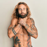 Back neck tattoo with intricate floral design, blending elegance and personal expression