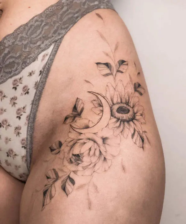 Sunflower tattoo that extends from the hip to the thigh, by @bakken_tattoo, blending floral beauty with lunar mystique