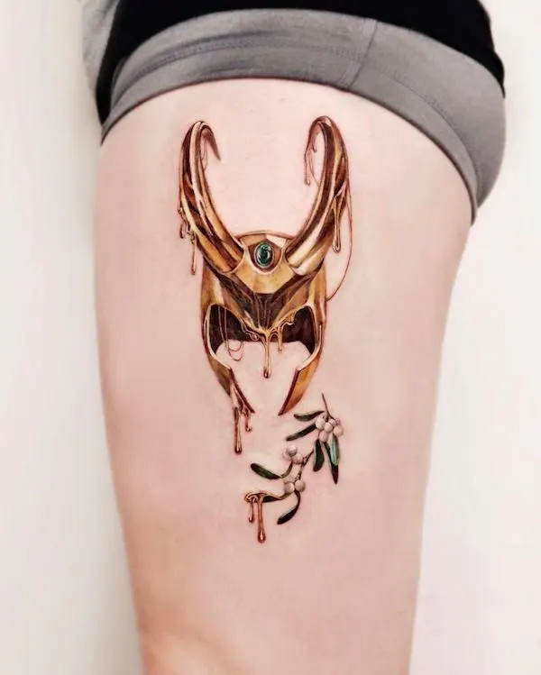 Loki's helmet and mistletoe tattoo on the thigh, by @chou_ta_1, blending mythology and nature