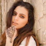 Intricate henna design on a hand
