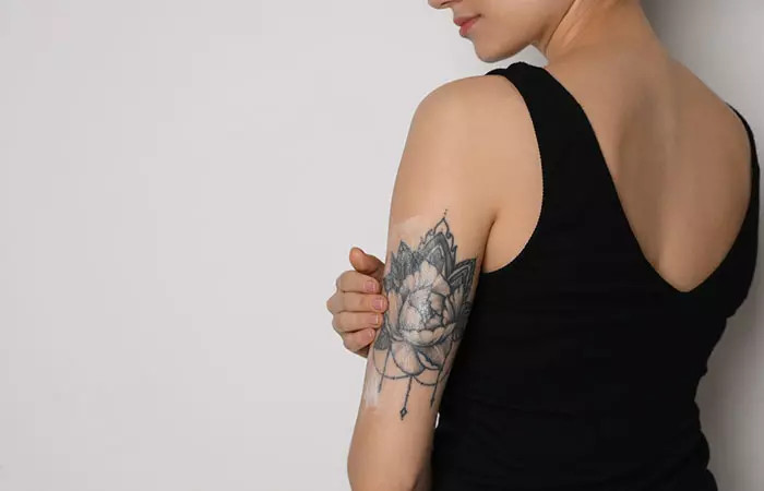 Applying lotion on a tattoo
