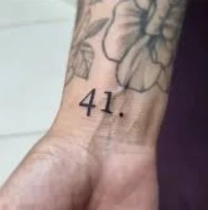 Cultural interpretations and symbolic meanings of the 41 tattoo.