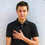 Tyler Joseph's arm tattoos featuring horizontal lines, symbolizing resilience