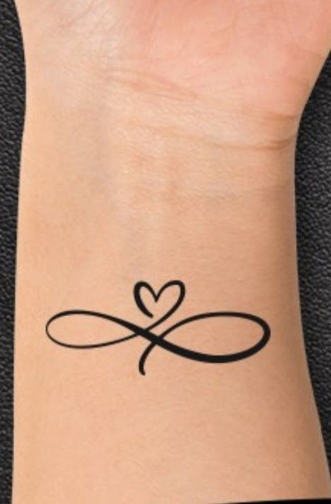 Infinity heart tattoo on wrist, black ink design symbolizing eternal love and connection, minimalist style.
