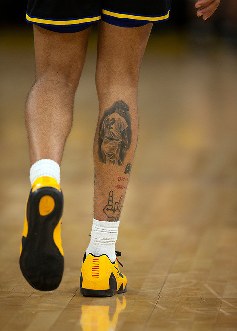 Jordan Poole's Jackie Robinson tattoo on his leg